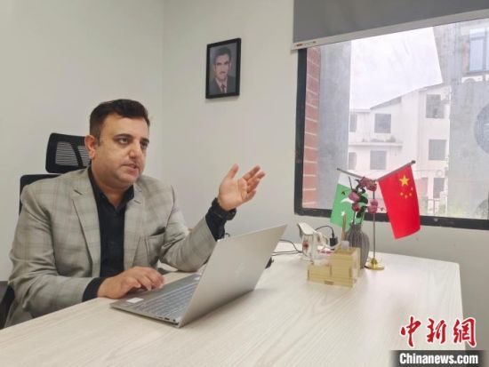 Haky, young Pakistani entrepreneur, receives interview with CNS. [photo/ Tang Xiaoqing]